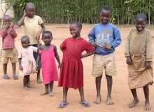 Children at the roadside in the Rwandan countryside pose for JT's camera
