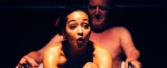 a young woman and older man in a bath together