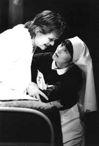 Woman on bed talking to nurse - Our Lady of Sligo production photo