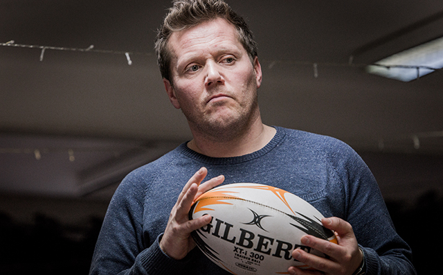 Rhys ap William holding a rugby ball