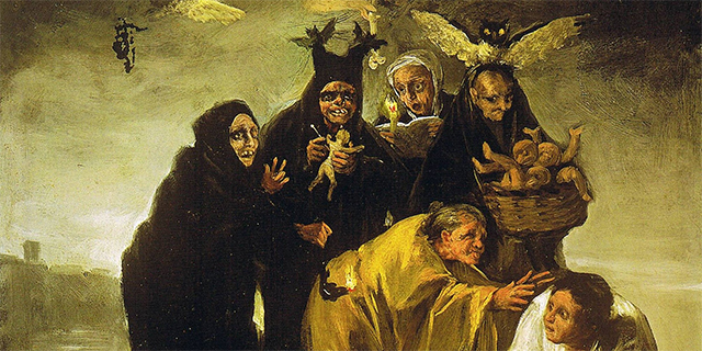 four women are standing in a row all wearing black cloaks one is holding a small human like figure, next to her another is holding a candle and book and next to her is the other holding a basket full of these small human like figures. Beneath them are two other women bending over one in a yellow robe who is reaching out to the other woman who is bent even further down dressed in white. In the background there are three birds hovering behind the women.