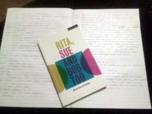 The published script of Rita Sue and Bob Too, resting on a page of handwritten script
